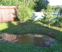 A farmer went to jail because of a pond on his property. Is it possible to dig a pond near a house?